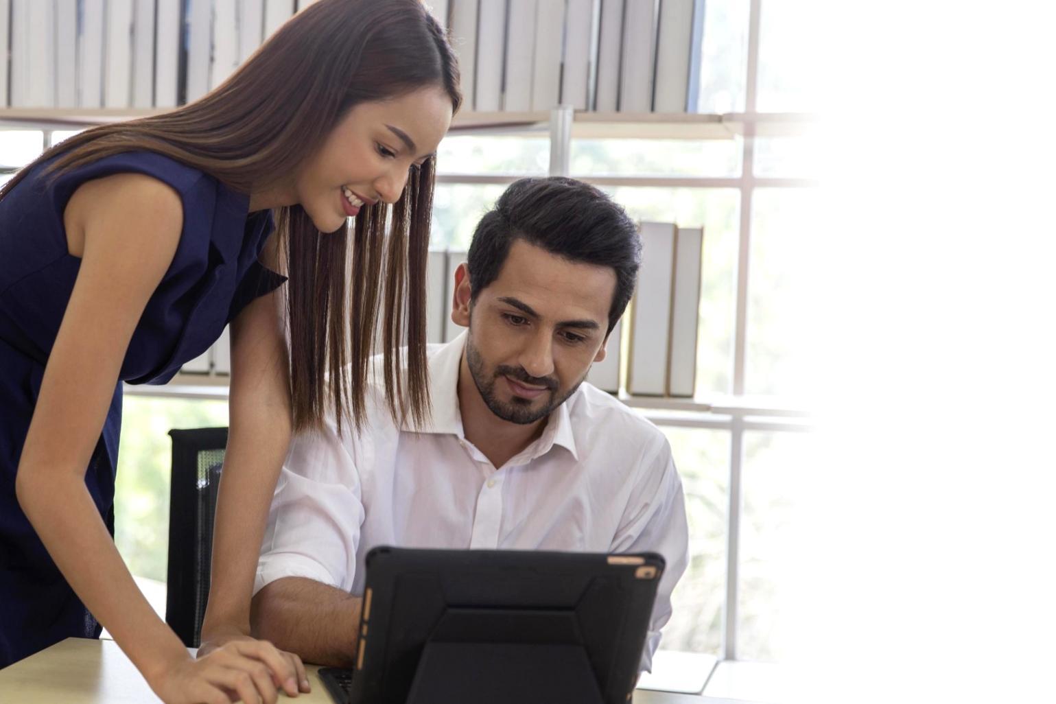 Graduate students reviewing their long-term investment progress